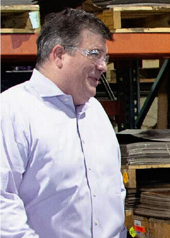 Scott Rivard of Saw Mill walks the warehouse with Allison Schultz, CEO of Southern Aluminum